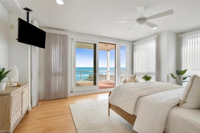 bedroom with ceiling fan, access to outside, and light wood-style floors