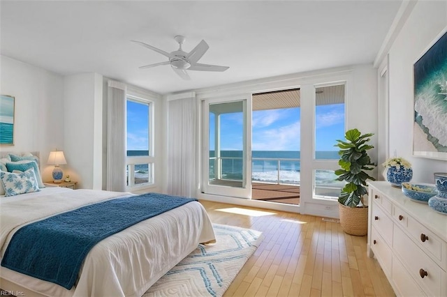 bedroom featuring light wood-type flooring, access to outside, and ceiling fan