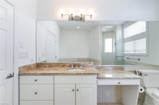 bathroom featuring toilet and vanity