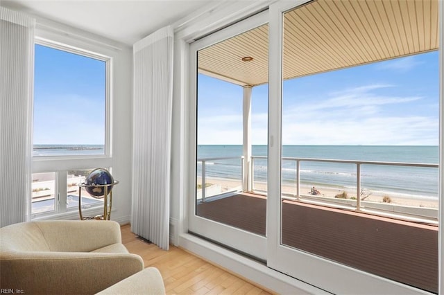 interior space featuring a water view and a view of the beach