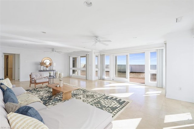 living area with a ceiling fan and recessed lighting