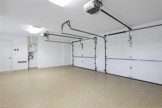 garage with a garage door opener, water heater, and baseboards