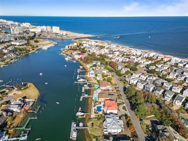 birds eye view of property with a water view and a residential view