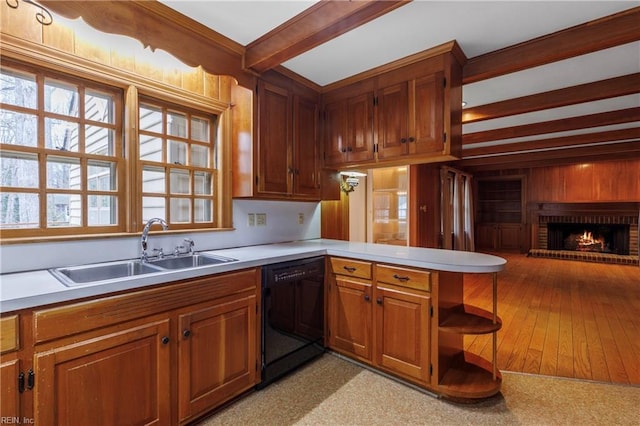 kitchen with dishwasher, a peninsula, beam ceiling, light countertops, and a sink