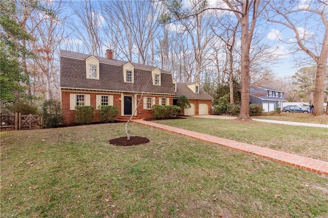 dutch colonial with an attached garage, roof with shingles, a front yard, and brick siding