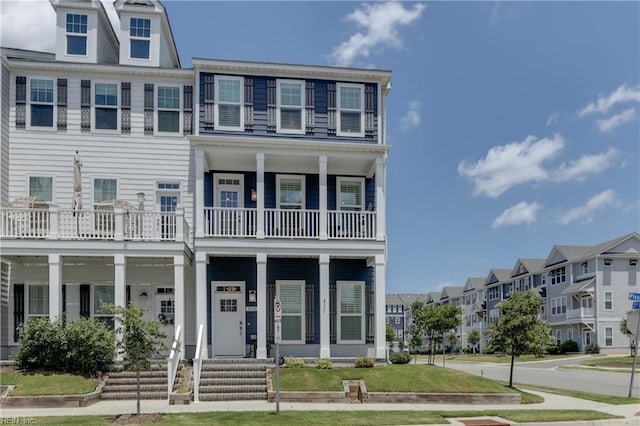 townhome / multi-family property with covered porch