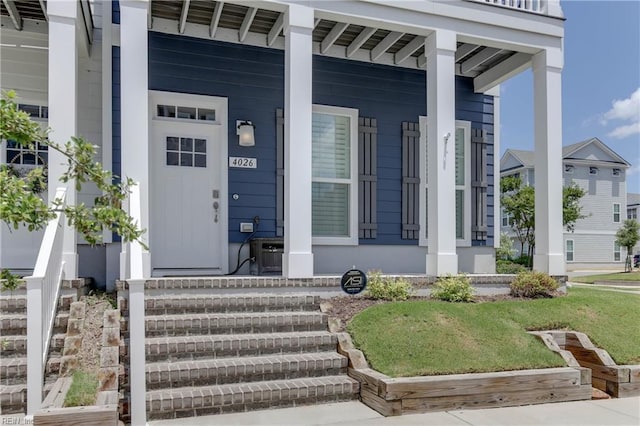 property entrance featuring a porch