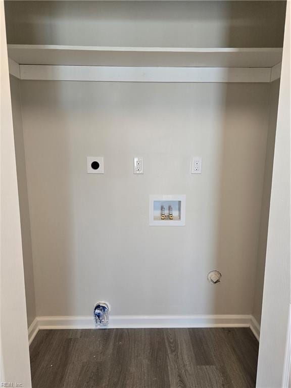 clothes washing area with hookup for a washing machine, dark wood-type flooring, electric dryer hookup, laundry area, and baseboards