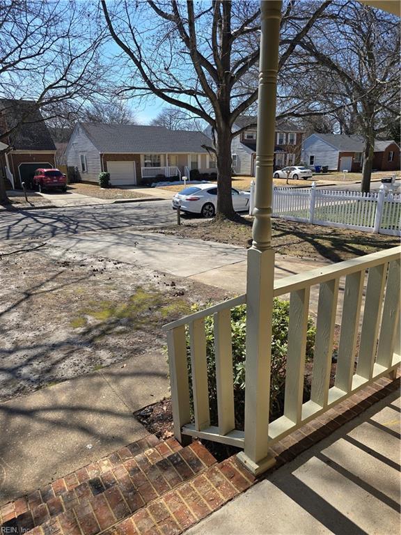 view of yard with a residential view and fence