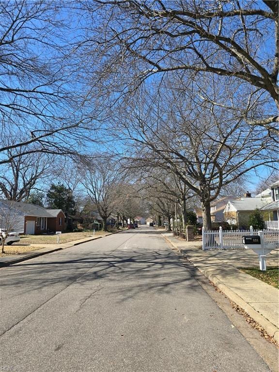 view of road featuring curbs and sidewalks