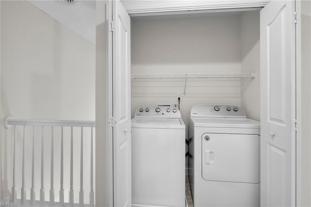 washroom with laundry area and washing machine and dryer