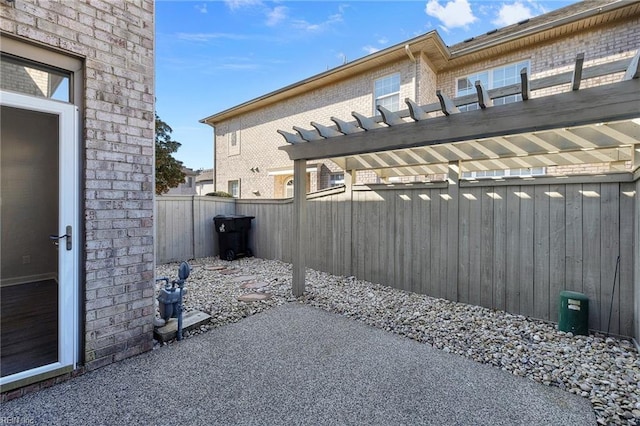 exterior space with a fenced backyard and a pergola