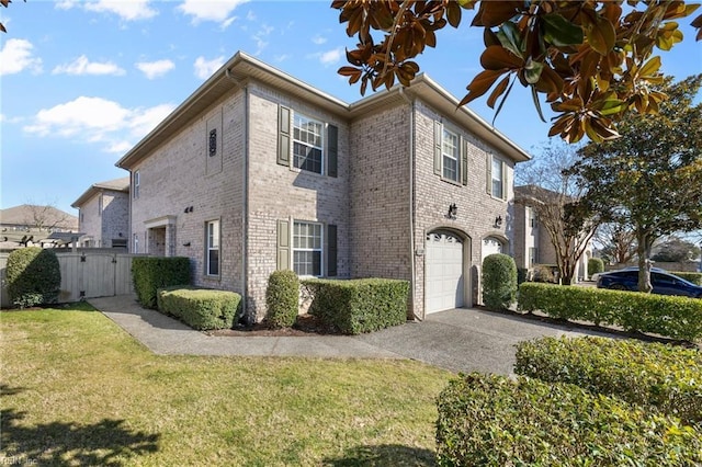 view of front of property featuring brick siding, concrete driveway, an attached garage, a gate, and a front yard