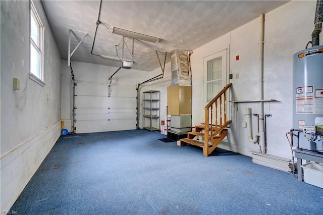 garage featuring a garage door opener and water heater