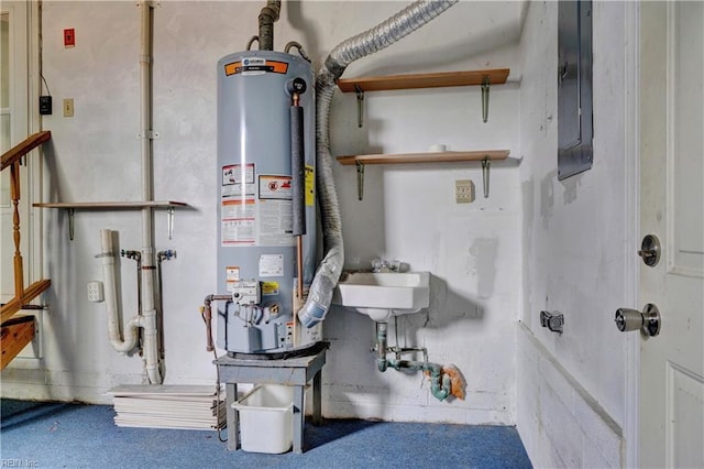 utilities with gas water heater and a sink