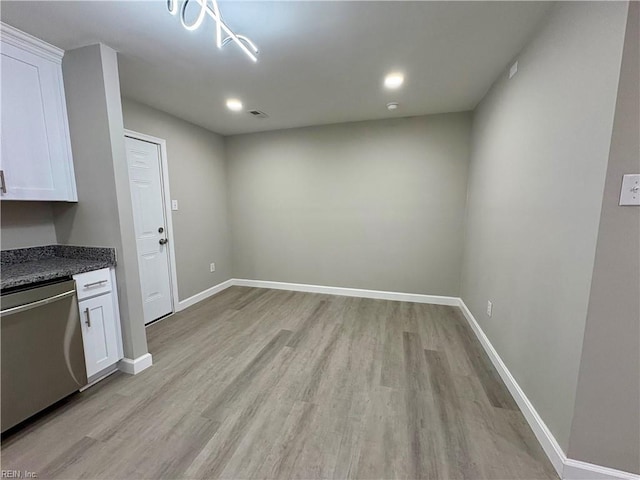 interior space featuring recessed lighting, baseboards, and light wood-style flooring