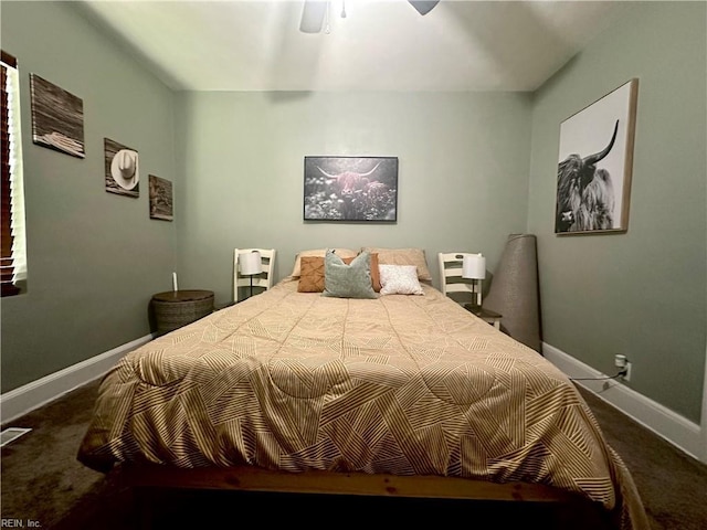 carpeted bedroom with a ceiling fan and baseboards