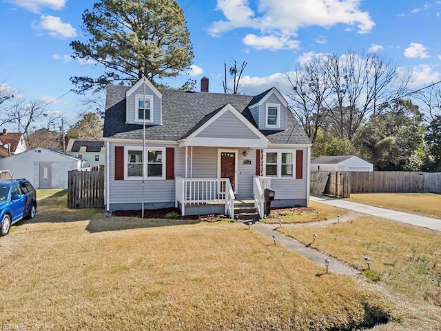 cape cod home featuring a shingled roof, fence, a front lawn, and a porch