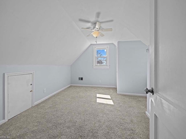 bonus room with lofted ceiling, carpet floors, visible vents, and baseboards