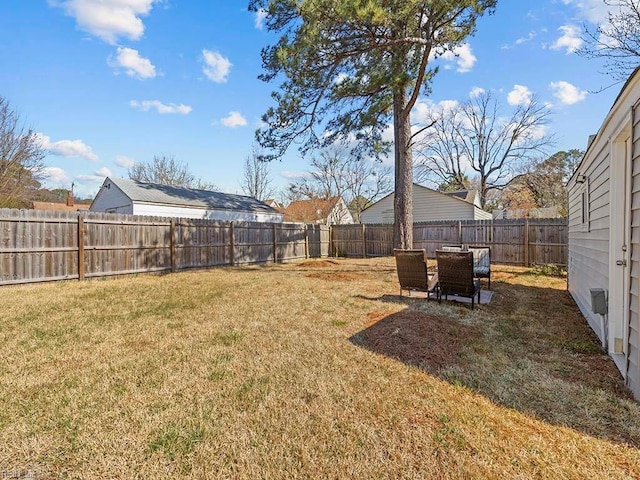 view of yard with a fenced backyard