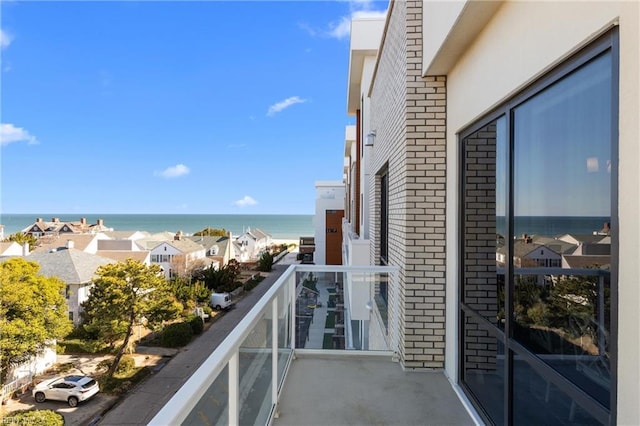 balcony featuring a water view