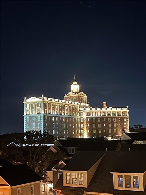 property at twilight featuring a view of city lights