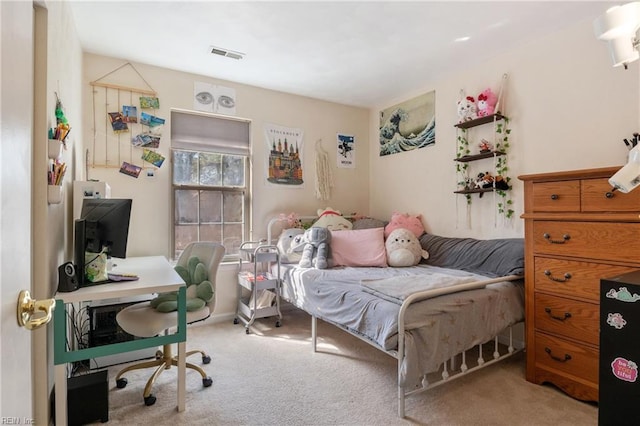 carpeted bedroom featuring visible vents