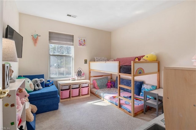 carpeted bedroom with visible vents