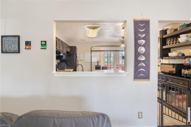 bedroom with freestanding refrigerator and french doors