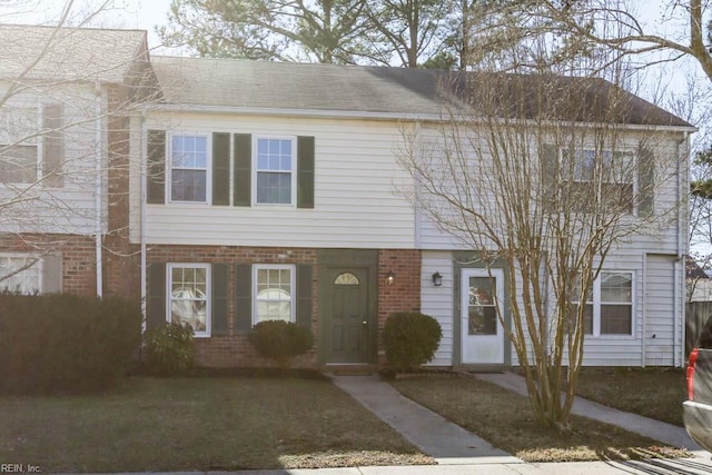 view of property with brick siding