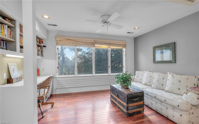 interior space featuring hardwood / wood-style floors, plenty of natural light, visible vents, and recessed lighting