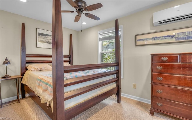 bedroom featuring a ceiling fan, light colored carpet, a wall mounted air conditioner, and baseboards