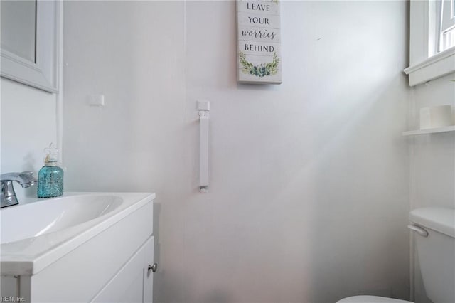 bathroom with toilet and vanity