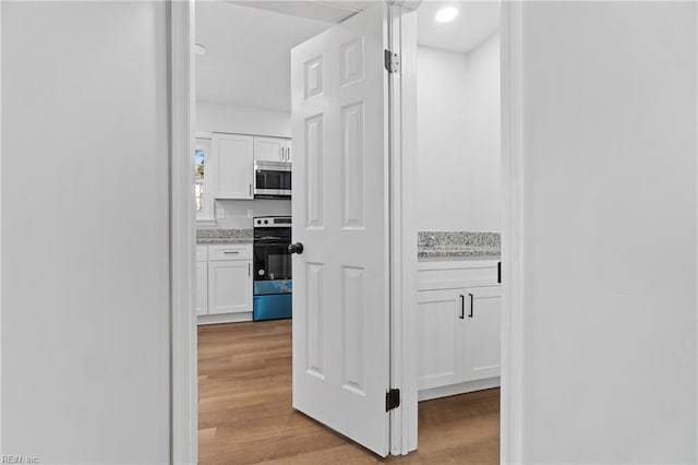 hallway featuring light wood-type flooring