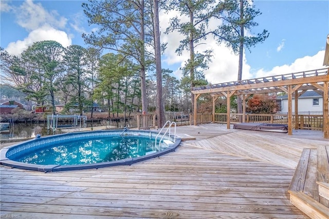 pool featuring a deck and a pergola