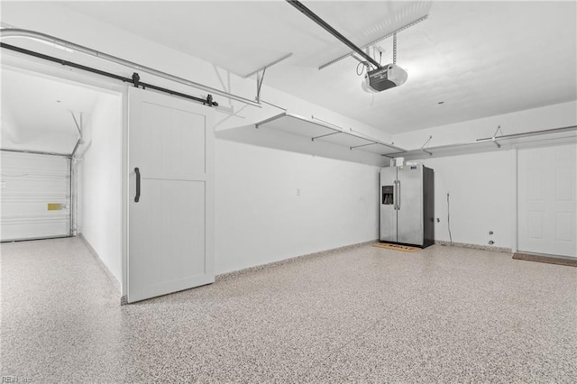 garage featuring a garage door opener and stainless steel fridge