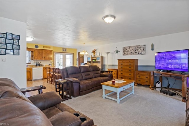 living room featuring french doors and light colored carpet