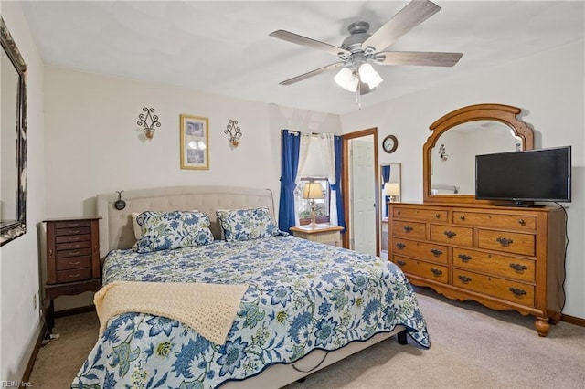 bedroom with a ceiling fan, carpet, and baseboards