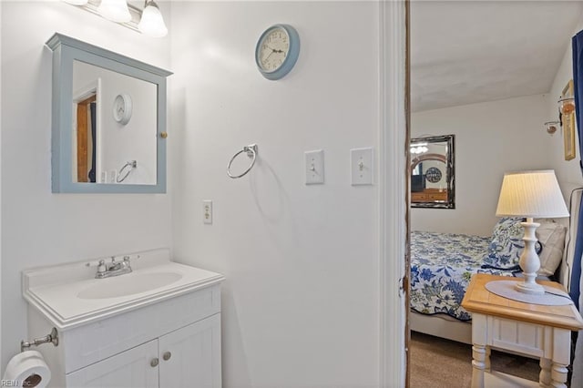 ensuite bathroom featuring ensuite bath and vanity