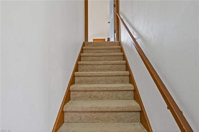 stairs featuring baseboards