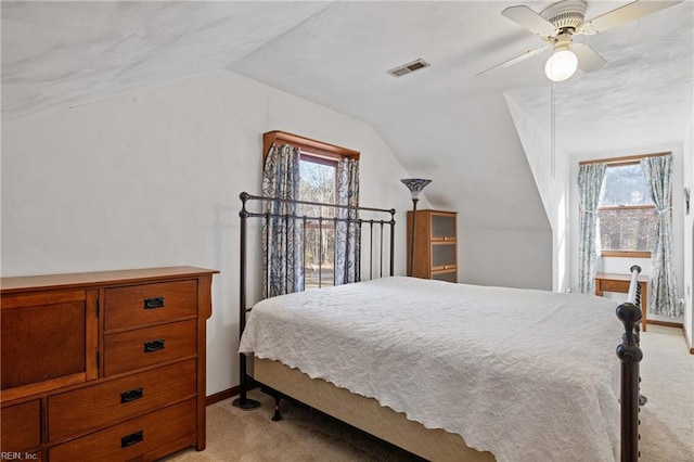 bedroom featuring light carpet, multiple windows, and visible vents