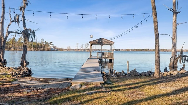 view of dock with a water view and a gazebo