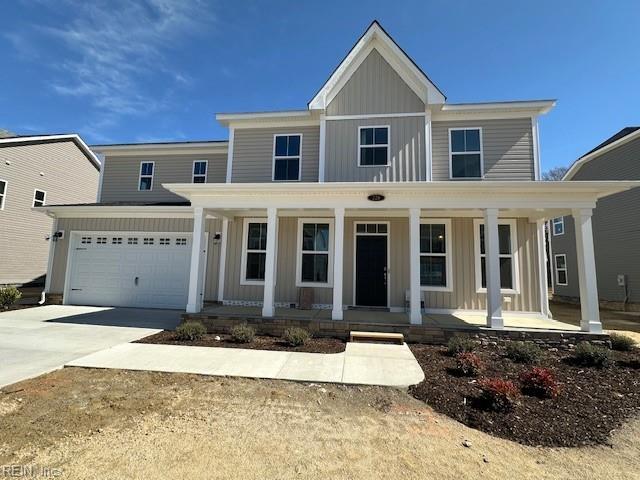 view of front of property with a garage, concrete driveway, a porch, and board and batten siding