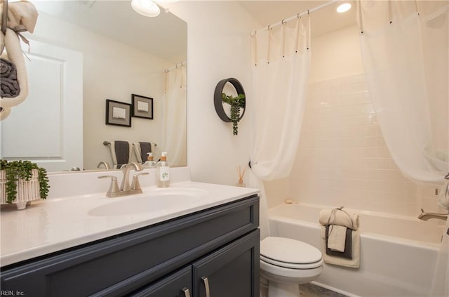 bathroom with toilet, shower / tub combo, and vanity