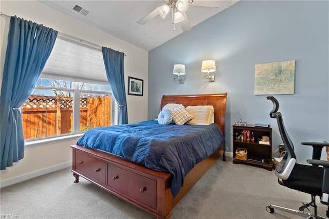 bedroom featuring lofted ceiling, visible vents, a ceiling fan, carpet flooring, and baseboards