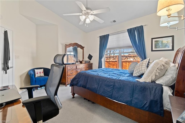 carpeted bedroom featuring vaulted ceiling, ceiling fan, and visible vents