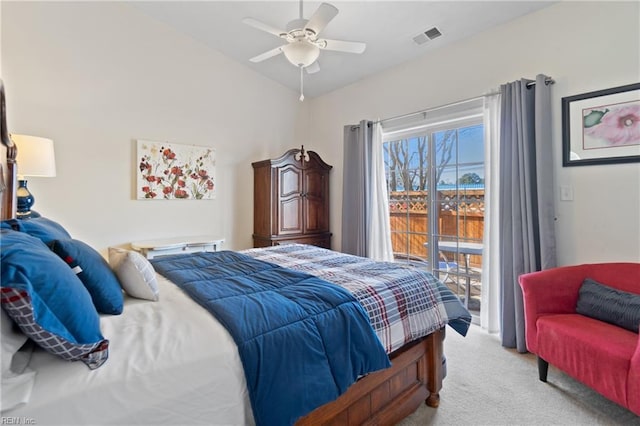 bedroom with visible vents, ceiling fan, access to exterior, vaulted ceiling, and carpet flooring