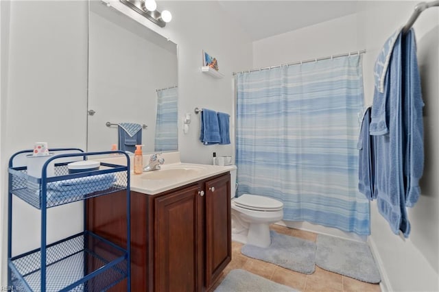 full bathroom featuring tile patterned flooring, a shower with curtain, vanity, and toilet