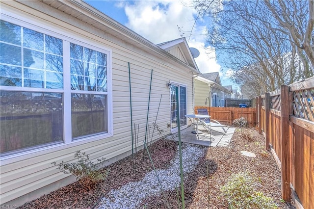 view of yard featuring a patio area and a fenced backyard