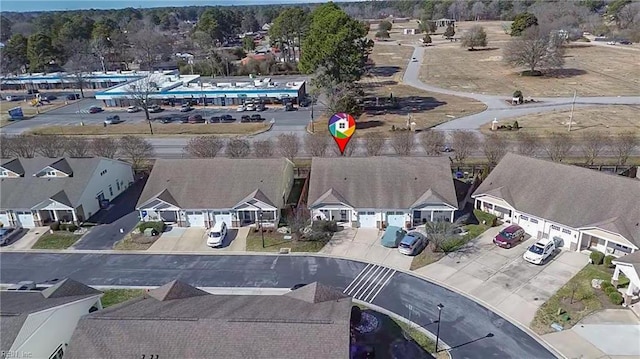 birds eye view of property with a residential view